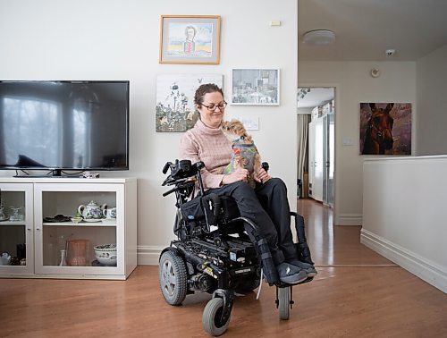 JESSICA LEE / WINNIPEG FREE PRESS

Yvette Cenerini, a digital collage maker and a wheelchair user, is photographed at her home in front of her two pieces with her dog Jasper on February 15, 2022, in St. Boniface.

Reporter: Eva