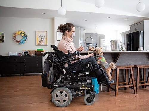 JESSICA LEE / WINNIPEG FREE PRESS

Yvette Cenerini, a digital collage maker and a wheelchair user, is photographed at her home with her dog Jasper on February 15, 2022, in St. Boniface.

Reporter: Eva
