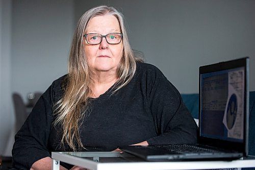 MIKAELA MACKENZIE / WINNIPEG FREE PRESS

Dr. Anne Lindsay, who does archival research in support of locating burial sites of missing Indigenous patients who never returned from Manitoba Tuberculosis Hospitals, poses for a portrait in her home in Winnipeg on Tuesday, Feb. 15, 2022. For Cody Sellar story.
Winnipeg Free Press 2022.