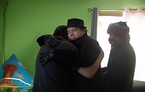 JESSICA LEE / WINNIPEG FREE PRESS

MKO Grand Chief Garrison Settee, who is from Pimicikamak Cree Nation, hugs a relative of the family affected at the grandfathers house of the North children on February 16, 2022 at Cross Lake. A fire occurred on February 12, 2022 at the North residence and took the lives of three children: Kolby North, 17, Jade North, 13 and Reid North, 3.

Reporter: Danielle
