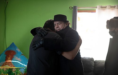 JESSICA LEE / WINNIPEG FREE PRESS

MKO Grand Chief Garrison Settee, who is from Pimicikamak Cree Nation, hugs a relative of the family affected at the grandfathers house of the North children on February 16, 2022 at Cross Lake. A fire occurred on February 12, 2022 at the North residence and took the lives of three children: Kolby North, 17, Jade North, 13 and Reid North, 3.

Reporter: Danielle