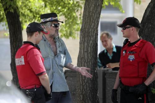 MIKE.DEAL@FREEPRESS.MB.CA 100721 - Wednesday, July 21, 2010 -  Members of the Down Town BIZ outreach patrol talk to someone while on patrol. MIKE DEAL / WINNIPEG FREE PRESS