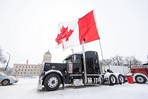 Mike Sudoma / Winnipeg Free Press
A massive Canadian flag is seen flying from the back of a semi truck Friday afternoon. The flag was ripped and damaged after a group from last Saturdays Anti Protest attempted to tear it down according to a protestor on scene.
February 18, 2022