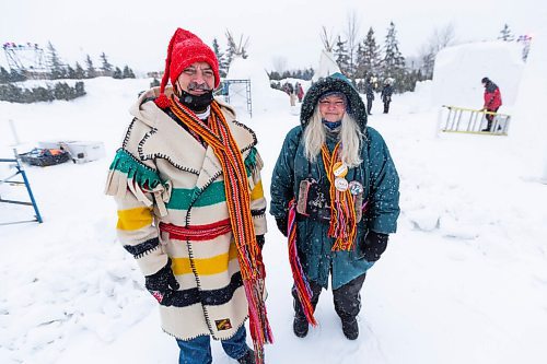 Daniel Crump / Winnipeg Free Press. Daniel Labrie (left) and  Lorinda Maruca (right) are volunteers at Festival du Voyageur. The Festival returns for the first time since prior to the pandemic. February 19, 2022.