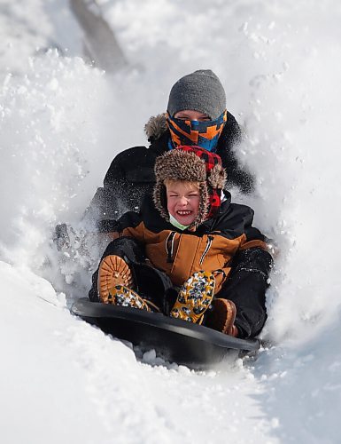 JOHN WOODS / WINNIPEG FREE PRESS
Marc Therrien and son Liam, 6, were out enjoying the new powder sledding at Fort Whyte, Sunday, February 20, 2022. Winnipeg and surrounding area received another dump of snow yesterday.

Re: standup