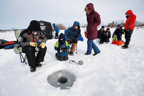 JOHN WOODS / WINNIPEG FREE PRESS
Emily MacDonald, from left, and friends Liam, 6, and his father and mother, Max Kreuser and Micheline Marchildon, and other family and friends enjoy a day of fishing at Lockport, Sunday, February 20, 2022. There is a licence free Winter Family Fishing Weekend happening this weekend. Emily MacDonald has been coming ice fishing with her parents since she was a baby.

Re: standup