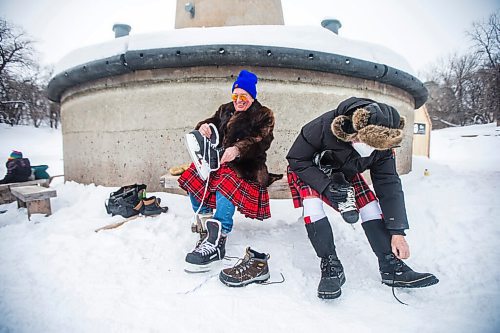 MIKAELA MACKENZIE / WINNIPEG FREE PRESS

Dwight MacAulay (left) and Peter Heavysege lace up for the Great Canadian Kilt Skate, put on by the St. Andrews Society of Winnipeg, at The Forks in Winnipeg on Monday, Feb. 21, 2022. Last year Winnipeg won the national title as kilt skate capital of Canada. Standup.
Winnipeg Free Press 2022.