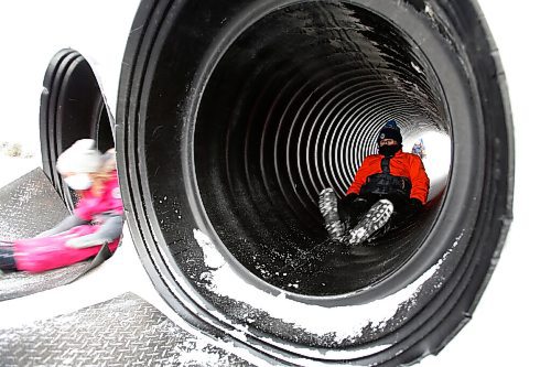 JOHN WOODS / WINNIPEG FREE PRESS
Children slide down a tube at the Festival du Voyageur, Monday, February 21, 2022. weekend.

Re: standup