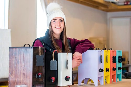 MIKAELA MACKENZIE / WINNIPEG FREE PRESS

Carmen Konzelman, founder of Uncorked Designs, poses for a portrait with her wine cabinets in Narol on Monday, Feb. 21, 2022. For Dave Sanderson story.
Winnipeg Free Press 2022.