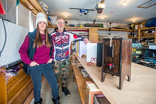 MIKAELA MACKENZIE / WINNIPEG FREE PRESS

Carmen Konzelman, founder of Uncorked Designs, and her dad, Gord Konzelman, pose for a portrait with the wine cabinets that they make and sell out of their garage in Narol on Monday, Feb. 21, 2022. For Dave Sanderson story.
Winnipeg Free Press 2022.