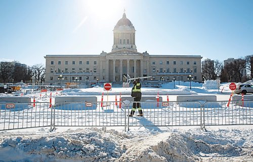 MIKE DEAL / WINNIPEG FREE PRESS
Cody Ducharme from Wallace and Wallace fencing removes a barrier, Wednesday morning, that was installed on the legislative grounds to keep vehicles off the property during the protests.
220223 - Wednesday, February 23, 2022.