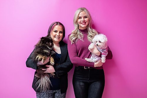 Daniel Crump / Winnipeg Free Press. Nikki Carruthers and Carly Reimer, co-owners of Neon Dragon, with their dogs Viper and Peep. Neon Dragon is a luxury pet studio opening this spring. February 23, 2022.