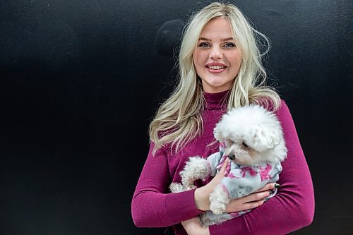 Daniel Crump / Winnipeg Free Press. Carly Reimer , co-owner of Neon Dragon, with her dog Peep. Neon Dragon is a luxury pet studio opening this spring. February 23, 2022.