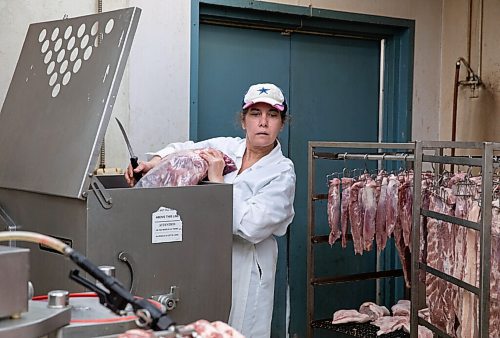 JESSICA LEE / WINNIPEG FREE PRESS
Michelle Mansell, owner, grinds pork at Frigs Natural Meats on February 22, 2022.
Reporter: Dave