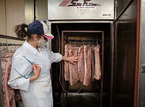 JESSICA LEE / WINNIPEG FREE PRESS

Michelle Mansell, owner, shows the bacon which is in the smoker at Frigs Natural Meats on February 22, 2022.

Reporter: Dave
