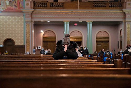 JESSICA LEE / WINNIPEG FREE PRESS

Winnipeg community members are photographed during a vigil at Sts. Vladimir and Olga Cathedral on February 24, 2022. The day before, bombs fell in Ukraine.
