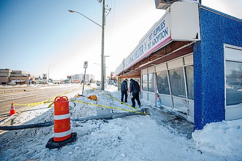 MIKE DEAL / WINNIPEG FREE PRESS
Debris from a car hitting the front of the Winnipeg Pet Rescue Shelter at 3062 Portage Avenue early Friday morning.
220225 - Friday, February 25, 2022.