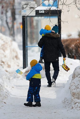 JOHN WOODS / WINNIPEG FREE PRESS
A boy carrying a Ukraine flag walks away from St Vladimir & Olga Cathedral on McGregor in Winnipeg Sunday, February 27, 2022. People were attending the church to pray for the people during the Russian invasion of The Ukraine.

Re: Macintosh