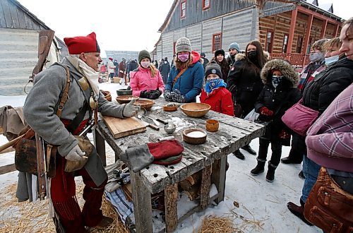 JOHN WOODS / WINNIPEG FREE PRESS
An interpreter speaks to visitors at the Festival du Voyageur Sunday, February 27, 2022. The Festival wraps up today 

Re: standup
