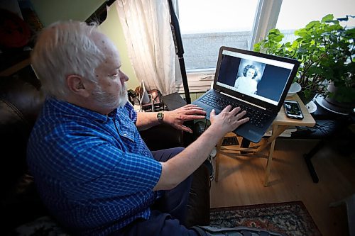 JOHN WOODS / WINNIPEG FREE PRESS
Wayne Turner, who is adopted and has discovered through a DNA analysis company that he has 10 siblings, is photographed as he looks at a photo of his birth mother in his home Monday, February 28, 2022. He has been able to talk to some of them and they hope to meet.

Re: Rollason