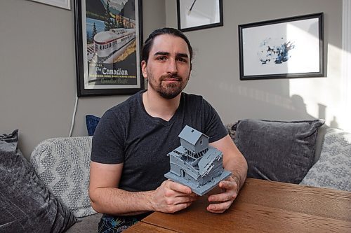 MIKE DEAL / WINNIPEG FREE PRESS
Patrick Letourneau with one of his 3D printed buildings he has carefully photographed and reproduced.
Where others see rot and decay Patrick Letourneau sees beauty. He gazes into spaces which once thrived and then, using modelling techniques such as photogrammetry and laser printing, he brings these doomed structures, destined for demolition, back to life. 
220301 - Tuesday, March 01, 2022.