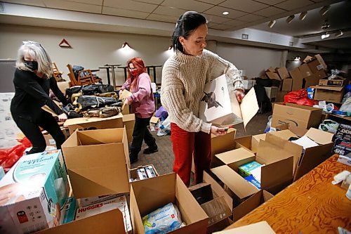 JOHN WOODS / WINNIPEG FREE PRESS
Anna Karpenko, right, and other volunteers pack boxes of requested essentials at the Ukrainian National Federation Tuesday, March 1, 2022. Karpenko organized the donation drive and plans to ship the items to Ukraine.

Re: Piche