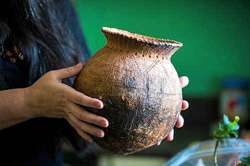 MIKAELA MACKENZIE / WINNIPEG FREE PRESS

KC Adams shows one of her handmade clay vessels (this one shaped for use in a fire) in her kitchen in Winnipeg on Tuesday, March 1, 2022. For Eva Wasney story.
Winnipeg Free Press 2022.