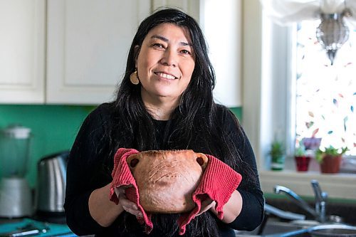 MIKAELA MACKENZIE / WINNIPEG FREE PRESS

KC Adams with her bison and wild rice stew in one of her handmade clay vessels in Winnipeg on Tuesday, March 1, 2022. For Eva Wasney story.
Winnipeg Free Press 2022.