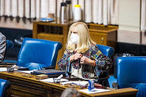 MIKAELA MACKENZIE / WINNIPEG FREE PRESS

PC MLA Cath Cox pins a ribbon for Ukraine on her shirt on the first day back in session at the Manitoba Legislative Building in Winnipeg on Wednesday, March 2, 2022. For Carol Sanders story.
Winnipeg Free Press 2022.