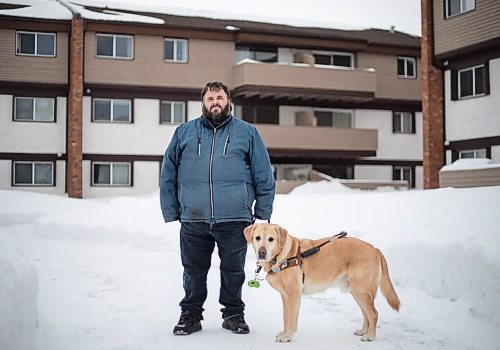 JESSICA LEE / WINNIPEG FREE PRESS

Brian Thorkelson poses for a photo with his service dog on March 4, 2022 outside his home. He is visually impaired and can see only light.

Reporter: Cody
