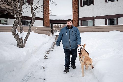 JESSICA LEE / WINNIPEG FREE PRESS

Brian Thorkelson poses for a photo with his service dog on March 4, 2022 outside his home. He is visually impaired and can see only light.

Reporter: Cody
