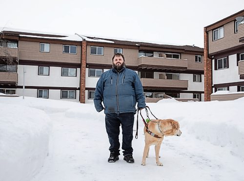 JESSICA LEE / WINNIPEG FREE PRESS

Brian Thorkelson poses for a photo with his service dog on March 4, 2022 outside his home. He is visually impaired and can see only light.

Reporter: Cody
