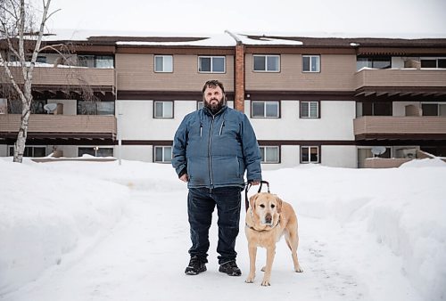 JESSICA LEE / WINNIPEG FREE PRESS

Brian Thorkelson poses for a photo with his service dog on March 4, 2022 outside his home. He is visually impaired and can see only light.

Reporter: Cody
