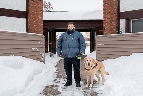 JESSICA LEE / WINNIPEG FREE PRESS

Brian Thorkelson poses for a photo with his service dog on March 4, 2022 outside his home. He is visually impaired and can see only light.

Reporter: Cody
