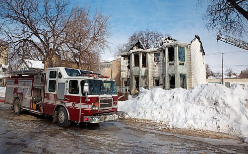 MIKE DEAL / WINNIPEG FREE PRESS
WFPS crews were still on the scene, Monday morning, at the duplex on Elgin Avenue that was destroyed by a fire that started Sunday evening.
WFPS crews were still on the scene of the duplex destroyed by fire Monday morning.
Residents of a duplex are safe but homeless after a fire destroyed the building Sunday night.
The Winnipeg Fire Paramedic Service said on Monday the blaze broke out in a two-and-a-half-storey duplex in the 300 block of Elgin Avenue on Sunday at 10:19 p.m.
220307 - Monday, March 07, 2022.