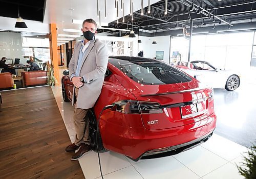 RUTH BONNEVILLE / WINNIPEG FREE PRESS

Biz - Tesla sales 

Portrait of Trevor Nott, owner of Nott Autocorp, next to a Tesla -  2021, model S Plaid edition, in his showroom.

Nott has seen a huge spike in people buying Teslas, especially as the price of gas increases.

Story - Gabby Piché

March 8th,  2022
