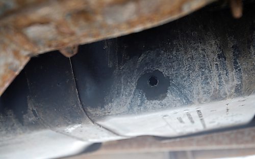 JOHN WOODS / WINNIPEG FREE PRESS
A gas tank of a vehicle at Little Peoples Place Daycare vans which was drilled and the gas stolen is photographed outside the daycare Tuesday, March 8, 2022. The childcare staff discovered that the gas tanks of their three vehicles were drilled and drained.