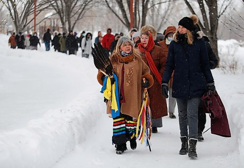 JOHN WOODS / WINNIPEG FREE PRESS
Elder Billie Schibler, left, and Kristie Pearson lead a Clan Mothers Healing Village walk to the MMIWG memorial statue at the Forks Tuesday, March 8, 2022. The group shared thoughts about Indigenous womens leadership and to remember those who are murdered and missing.