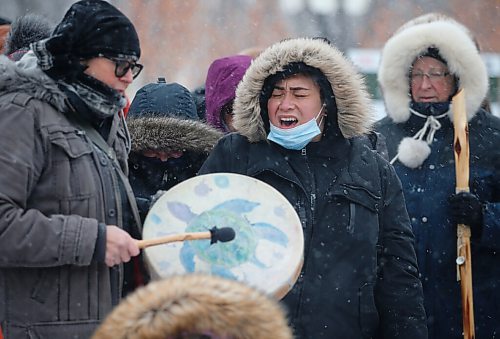 JOHN WOODS / WINNIPEG FREE PRESS
Singers at a Clan Mothers Healing Village walk to the MMIWG memorial statue at the Forks Tuesday, March 8, 2022. The group shared thoughts about Indigenous womens leadership and to remember those who are murdered and missing.