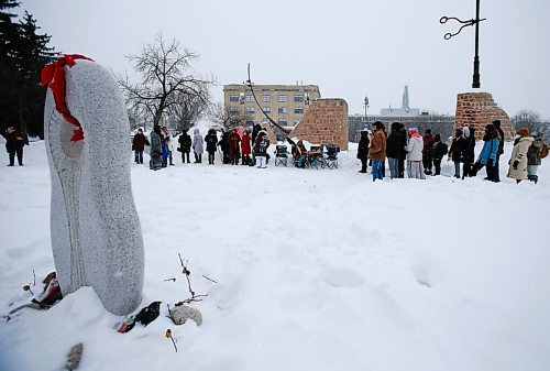 JOHN WOODS / WINNIPEG FREE PRESS
People gather for a Clan Mothers Healing Village walk to the MMIWG memorial statue at the Forks Tuesday, March 8, 2022. The group shared thoughts about Indigenous womens leadership and to remember those who are murdered and missing.