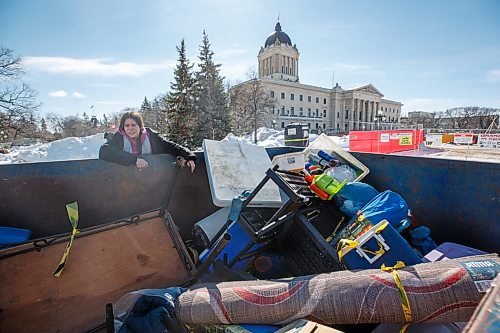 MIKE DEAL / WINNIPEG FREE PRESS
Melahat Paul a fire keeper at the Sacred Fire camp on the east side of the Manitoba Legislative building looks at the remains of their kitchen in one of the dumpsters that were brought in for the security team while they destroyed their camp.
The people at the two peace camps that have been on the grounds of the Manitoba Legislative building were confronted by Provincial Security officers around 7 a.m. Wednesday morning. The officers had bulldozers with them and they dismantled structures on both camps only stopping when occupiers were forced to throw themselves in front of the heavy machinery.
One of the camps which has had a sacred fire burning for almost a year on the east side of the building had several of their tents destroyed including their kitchen which held donated foods for the fire keepers. The other camp in Memorial Park, which has been around since September, but grew larger during the convoy protest had a few structures bulldozed and removed.
See Codey Sellar story
220309 - Wednesday, March 09, 2022.