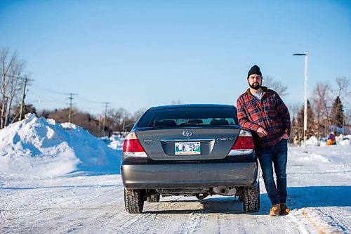 MIKAELA MACKENZIE / WINNIPEG FREE PRESS

Brett Parkin, who hasnt driven for SkipTheDishes for three weeks because of gas prices, poses for a portrait with his car in Winnipeg on Wednesday, March 9, 2022. For Gabby story.
Winnipeg Free Press 2022.