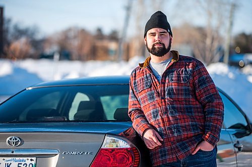 MIKAELA MACKENZIE / WINNIPEG FREE PRESS

Brett Parkin, who hasnt driven for SkipTheDishes for three weeks because of gas prices, poses for a portrait with his car in Winnipeg on Wednesday, March 9, 2022. For Gabby story.
Winnipeg Free Press 2022.