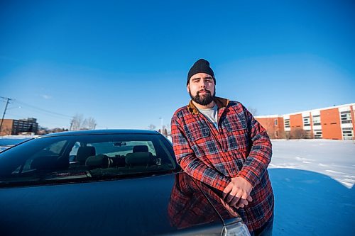 MIKAELA MACKENZIE / WINNIPEG FREE PRESS

Brett Parkin, who hasnt driven for SkipTheDishes for three weeks because of gas prices, poses for a portrait with his car in Winnipeg on Wednesday, March 9, 2022. For Gabby story.
Winnipeg Free Press 2022.