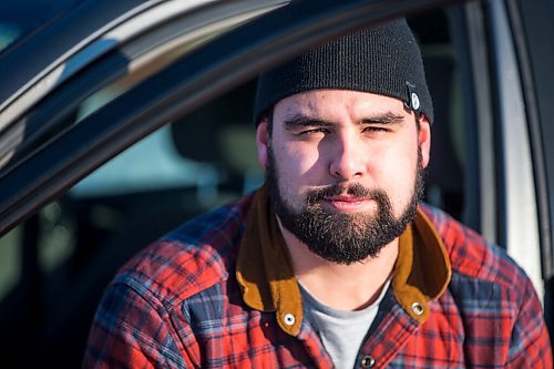 MIKAELA MACKENZIE / WINNIPEG FREE PRESS

Brett Parkin, who hasnt driven for SkipTheDishes for three weeks because of gas prices, poses for a portrait with his car in Winnipeg on Wednesday, March 9, 2022. For Gabby story.
Winnipeg Free Press 2022.