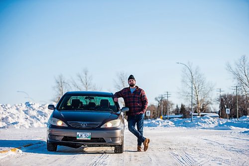 MIKAELA MACKENZIE / WINNIPEG FREE PRESS

Brett Parkin, who hasnt driven for SkipTheDishes for three weeks because of gas prices, poses for a portrait with his car in Winnipeg on Wednesday, March 9, 2022. For Gabby story.
Winnipeg Free Press 2022.