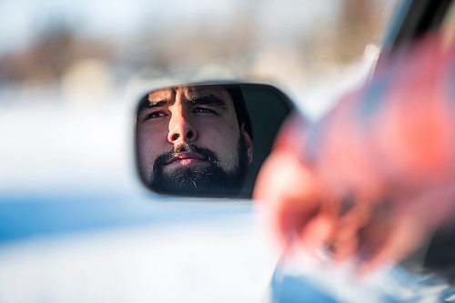 MIKAELA MACKENZIE / WINNIPEG FREE PRESS

Brett Parkin, who hasnt driven for SkipTheDishes for three weeks because of gas prices, poses for a portrait with his car in Winnipeg on Wednesday, March 9, 2022. For Gabby story.
Winnipeg Free Press 2022.