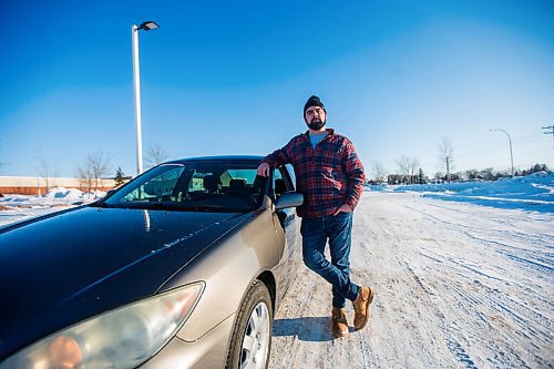 MIKAELA MACKENZIE / WINNIPEG FREE PRESS

Brett Parkin, who hasnt driven for SkipTheDishes for three weeks because of gas prices, poses for a portrait with his car in Winnipeg on Wednesday, March 9, 2022. For Gabby story.
Winnipeg Free Press 2022.