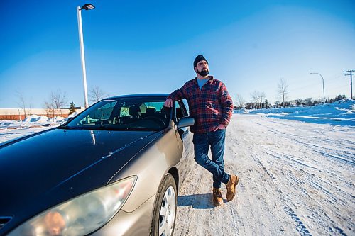 MIKAELA MACKENZIE / WINNIPEG FREE PRESS

Brett Parkin, who hasnt driven for SkipTheDishes for three weeks because of gas prices, poses for a portrait with his car in Winnipeg on Wednesday, March 9, 2022. For Gabby story.
Winnipeg Free Press 2022.