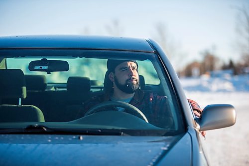 MIKAELA MACKENZIE / WINNIPEG FREE PRESS

Brett Parkin, who hasnt driven for SkipTheDishes for three weeks because of gas prices, poses for a portrait with his car in Winnipeg on Wednesday, March 9, 2022. For Gabby story.
Winnipeg Free Press 2022.